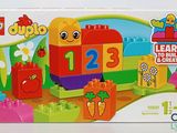 a box of lego duplo toys with a picture of a train and carrots