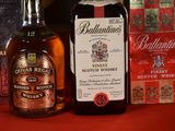 a bottle of ballant ' s finest scotch whisky next to a box of whisky