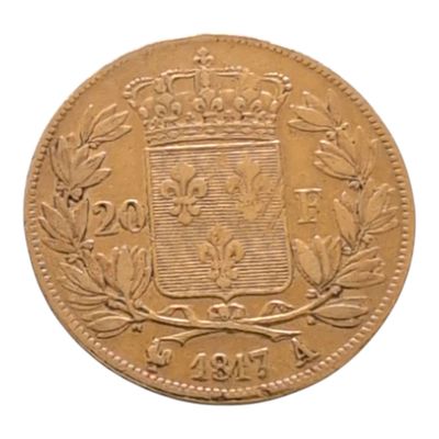 Gros plan sur une pièce d'or ornée d'une couronne