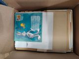 a picture of a book in a box on the floor