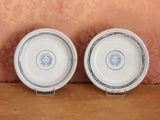 two plates that are sitting on a table