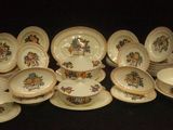 many plates and bowls that are sitting on a table