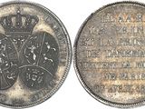 a close up of a coin with a crown on top of it