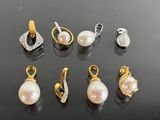 several different types of pearl and diamond earrings on a black surface