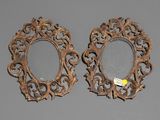 pair of antique carved wood mirrors with ornate designs