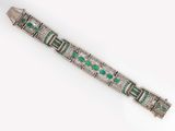 an art deco bracelet with emeralds and diamonds