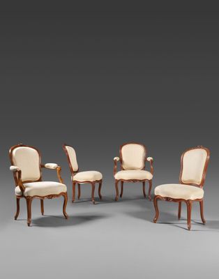 un ensemble de six fauteuils rembourrés en noyer, de style Louis II
