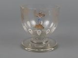 a glass cup with a picture of a man on it