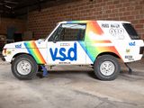 a van that is parked in a garage with graffiti on the side of it