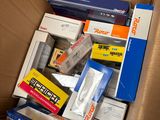 a cardboard box full of different types of electronic equipment