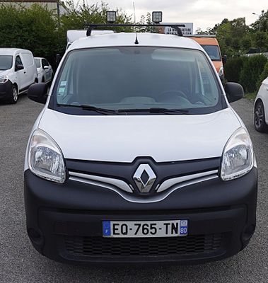 a white van that is parked in a parking lot