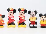 mickey and minnie mouse figurines are lined up in a row