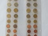 two bags of coins sitting on top of a table next to each other