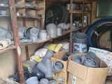 many pots and pans on the shelves in the room