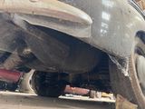 a close up of a car with a tire on the ground