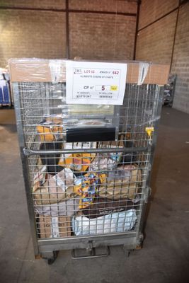a metal cart with food inside of it in a warehouse