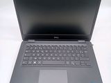 the dell laptop is open and ready to be used