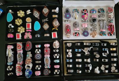 many different types of jewelry in a black case