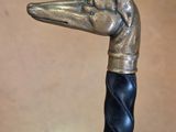 a close up of a cane with a bird head on it