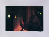a polaroid picture of a man and a woman talking on the phone