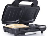 a close up of a toaster with a sandwich in it
