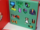 a red box with a set of action figures inside of it
