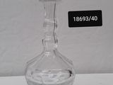 an image of a clear glass decanter sitting on a table