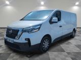a white van parked in a room with a checkered floor