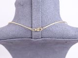 a close up of a necklace on a mannequin neck