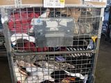 a metal cage filled with many pairs of shoes