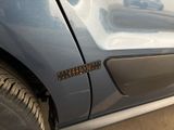 a close up of a car door with a sticker on it