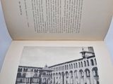 an open book with a picture of a building in it