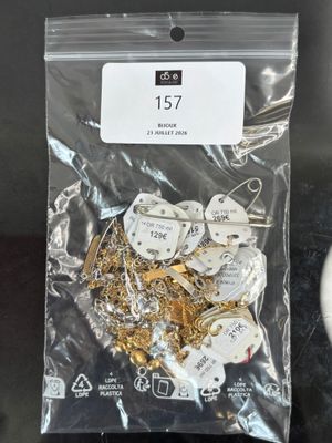 a bag of gold and silver jewelry on a table