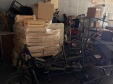 a pile of boxes and a bike in a warehouse