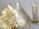 two vases sitting next to each other on a table