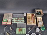 many different types of fishing equipment on the table