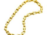 a close up of a gold chain on a white background