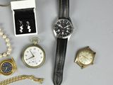many different types of watches and bracelets laid out on a table