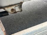 a close up of a rusted metal object on the ground