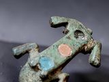 a figurine of a dog that is sitting on a table