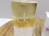 a box of perfume sitting on a table next to a box of perfume