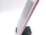 a cell phone that is sitting on a stand