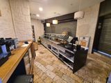 a counter with a bunch of items on it in the kitchen