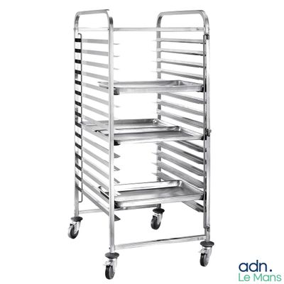 a close up of a metal tray on a dolly with wheels