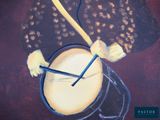 a painting of a cup of coffee with a spoon in it