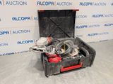 an open tool box with tools in it sitting on a floor