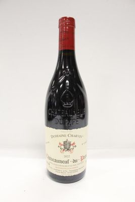 an image of a bottle of red wine sitting on a table