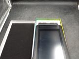 a tablet and a cell phone sitting on a table