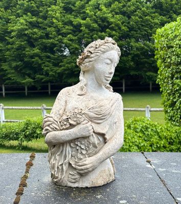 a statue of a woman holding a baby in her arms