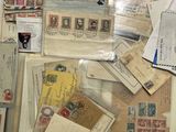 many different types of stamps and envelopes laid out on a table